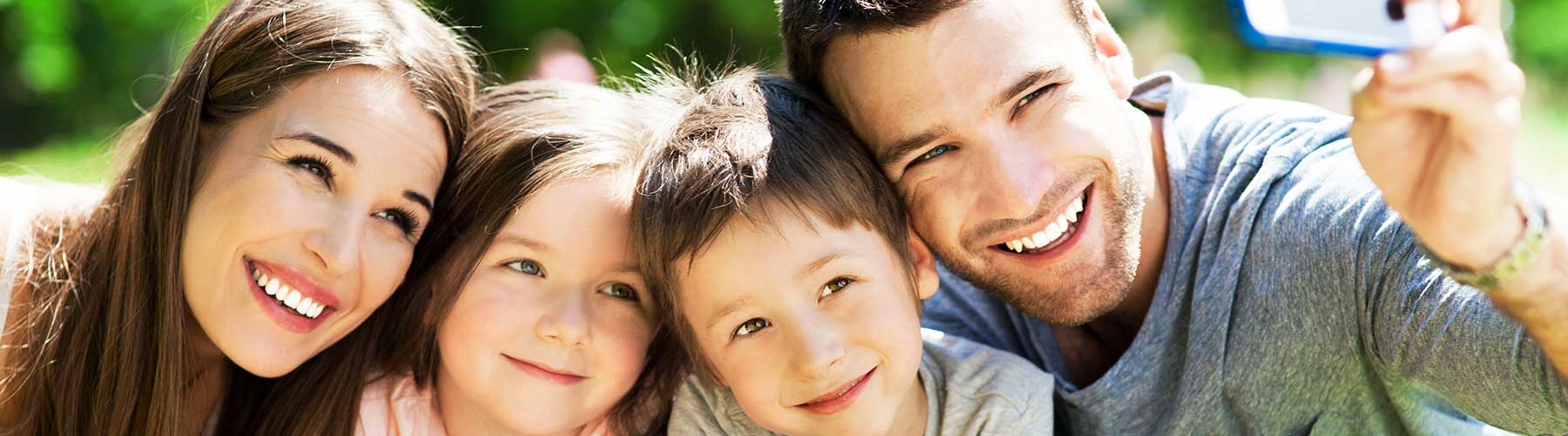 Business insurance represented by a woman placing an open sign in a shop window